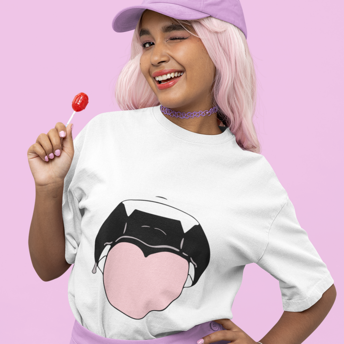 Woman wearing Heart Tongue Hentai Tee in white winking and holding lollipop.