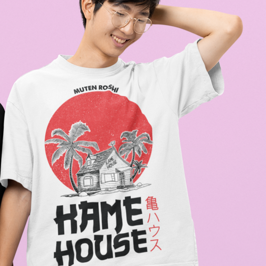 Happy man wearing Dragon Ball Kame House Tee in white smiling with his hand behind his head.