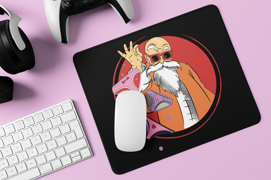 Closeup of Master Roshi Underwear Toss Mouse Pad on gamer's desk surrounded by accessories