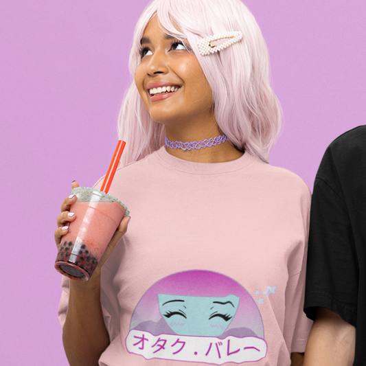 Woman wearing Otaku Valley Logo Tee in pink drinking boba tea.