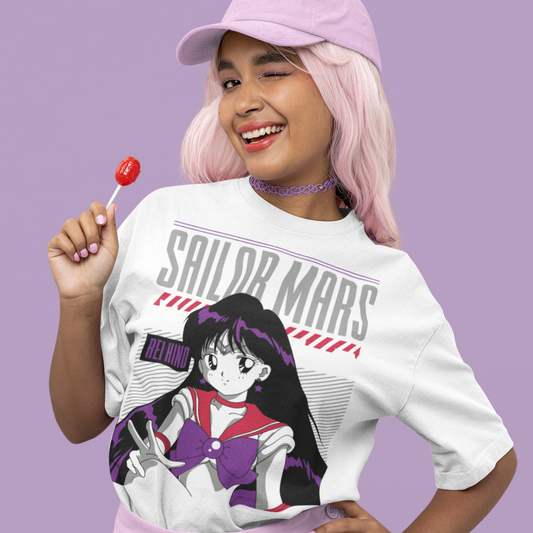 Woman wearing a Sailor Mars Crystal Power Tee in white winking at the camera.