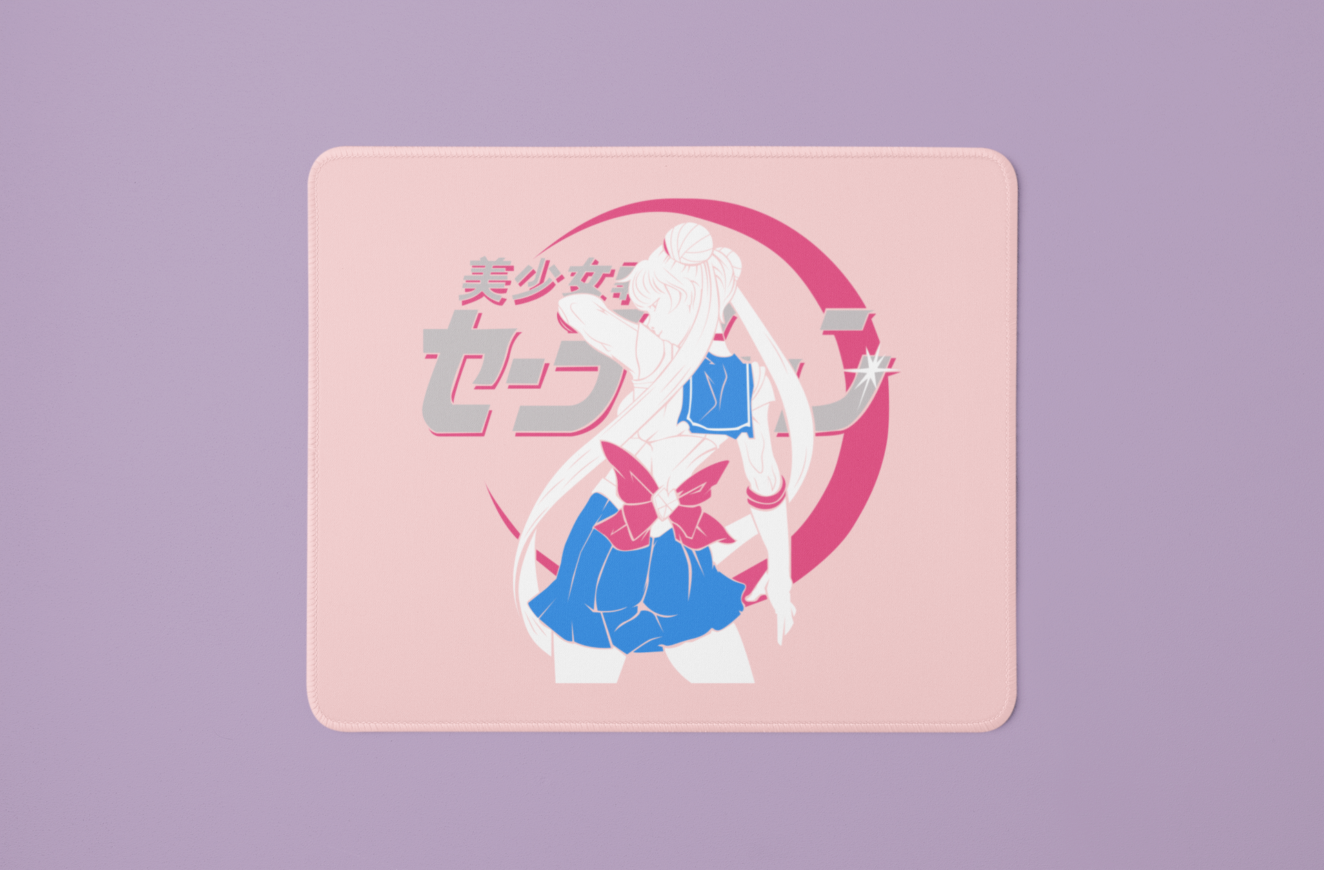 Sailor Moon Dynamic Pose Mouse Pad in pink against minimalist surface.