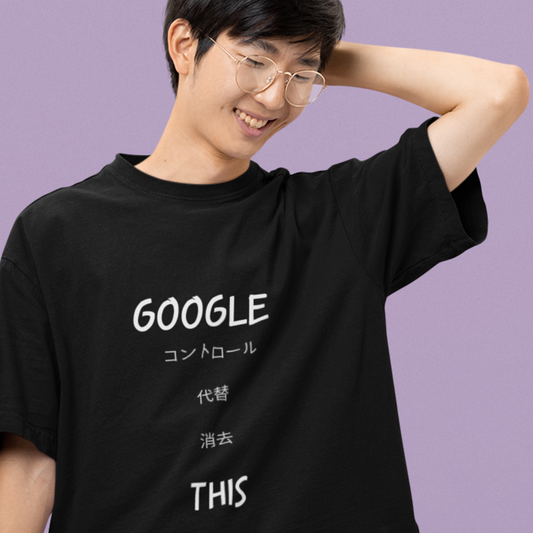 Happy man wearing Google This Kanji Tee in black smiling with his hand behind his head.