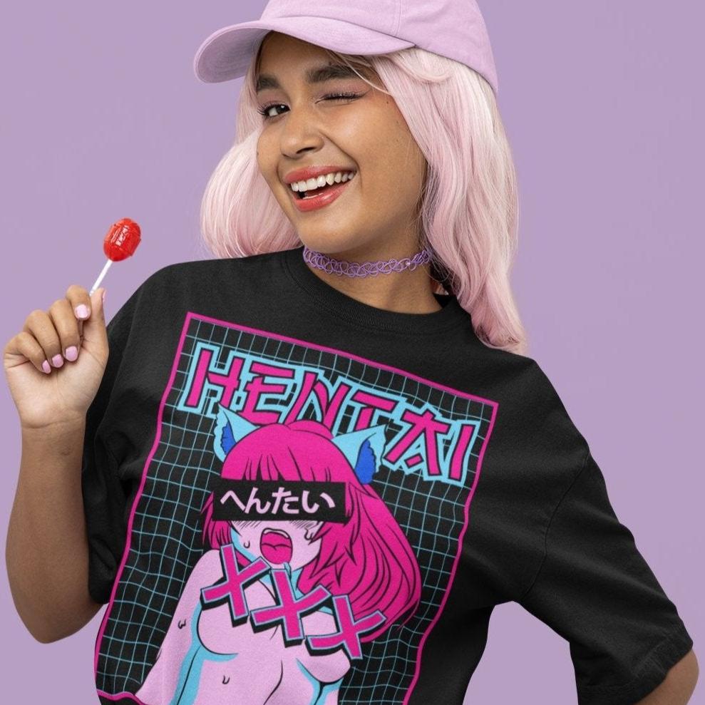 Woman wearing a Hentai Catgirl Tee in black winking at the camera.